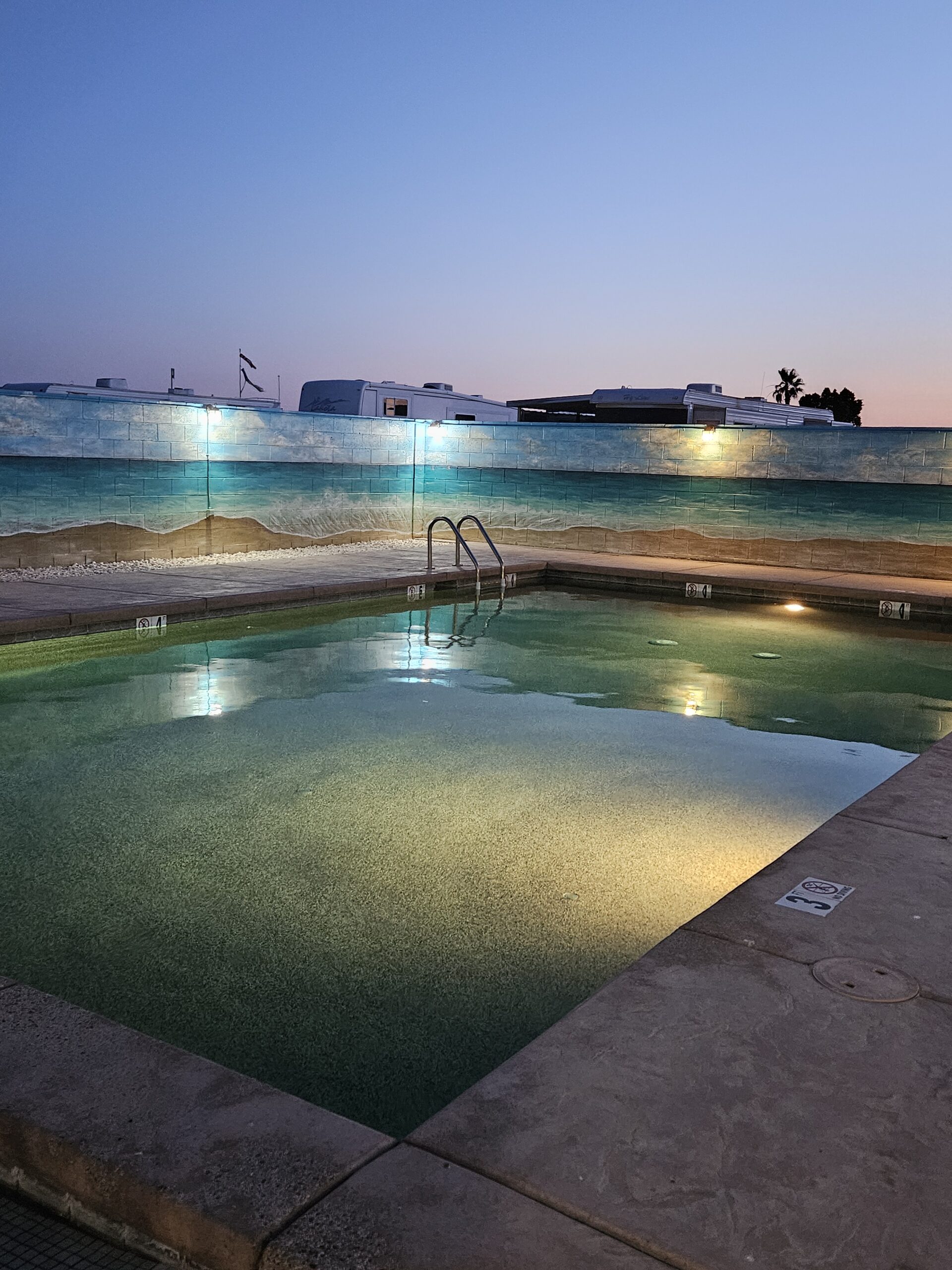 Western Sands RV Resort swimming pool at night